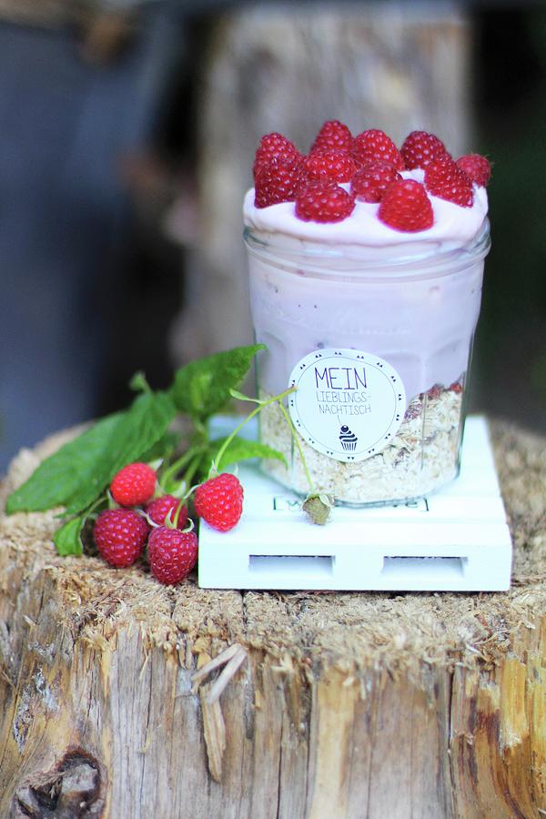 A Layered Dessert With Muesli And Raspberry Cream In A Preserving Jar With A Deocrative Label Photograph by Sylvia E.k Photography