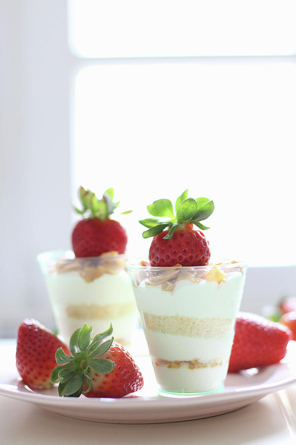 A Layered Dessert With Strawberries And Flaked Almonds In Glasses Photograph by Sylvia E.k Photography