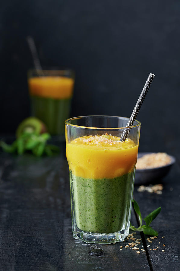 A Layered, Green-and-yellow Smoothie With Lambs Lettuce, Kiwi And Mango Photograph by Stefan Schulte-ladbeck