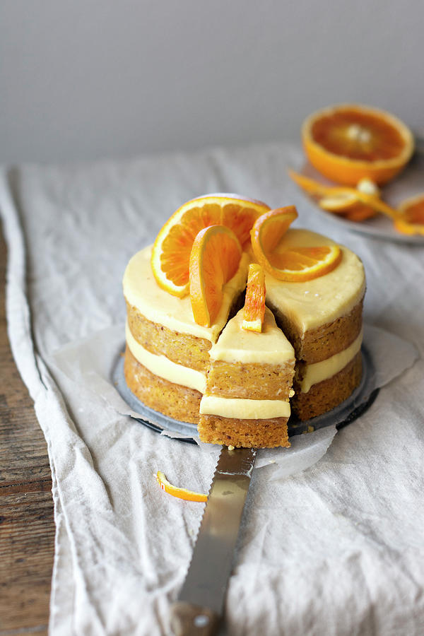 A Layered Orange Cake, Sliced Photograph by Pilar Felix