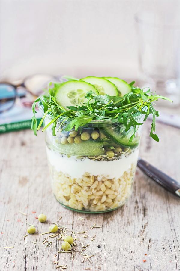 A Layered Pea And Cucumber Salad With Wheat, Yoghurt And Rocket In A Glass Photograph by Leah Bethmann