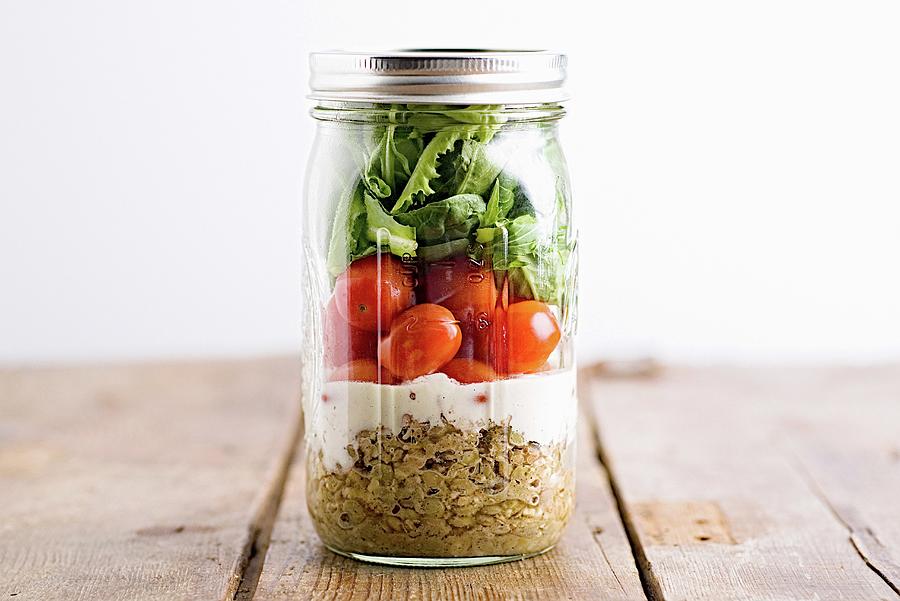 A Layered Salad In A Screw Top Glass Jar Photograph by Fred + Elliott  Photography