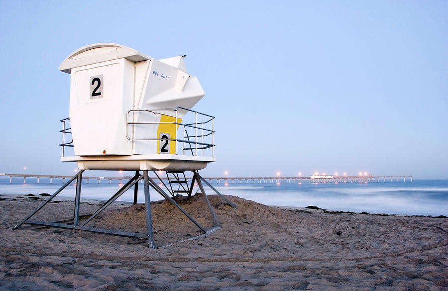 A Lifeguard Tower Sits On The Beach At Photograph by Rachid Dahnoun
