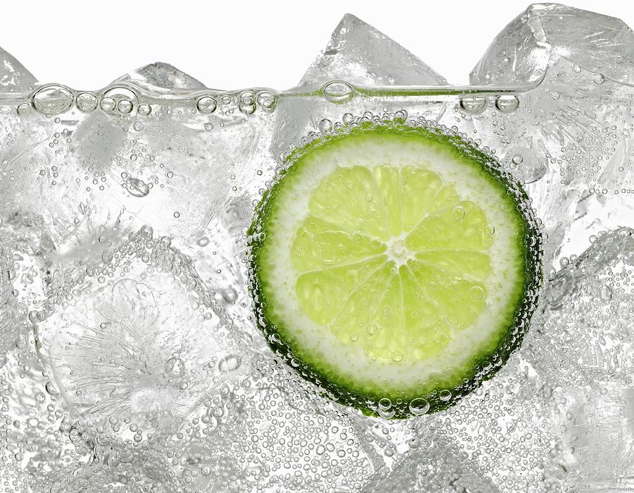 A Lime Slice In Soda Water Photograph by Loader, Mark