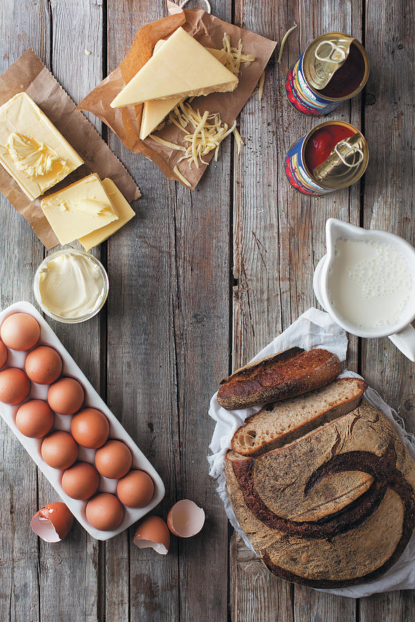 A Loaf Of Bread, Eggs, Dairy Products And A Tin Of Tomatoes Photograph by Great Stock!