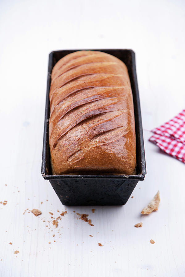 A Loaf Of Bread In A Baking Tin Photograph by Michael Wissing