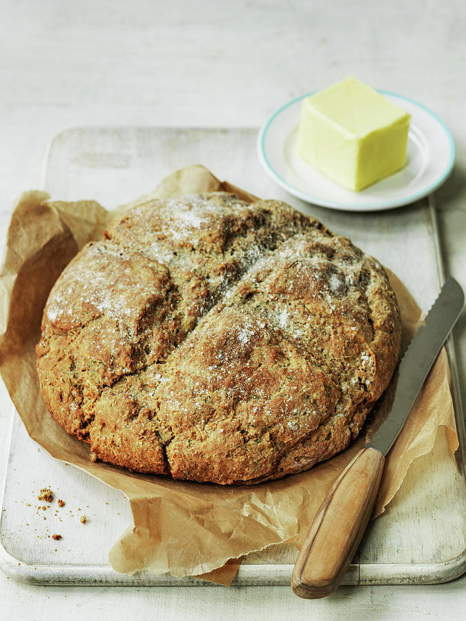 A Loaf Of Irish Soda Bread And Butter With Knife Photograph by Michael Paul