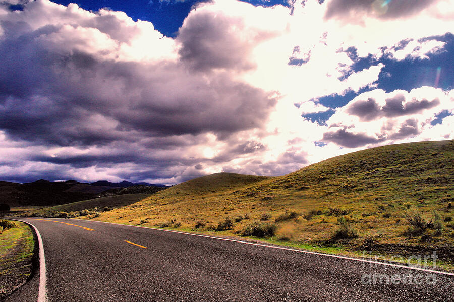 A long road alone Photograph by Jeff Swan - Pixels