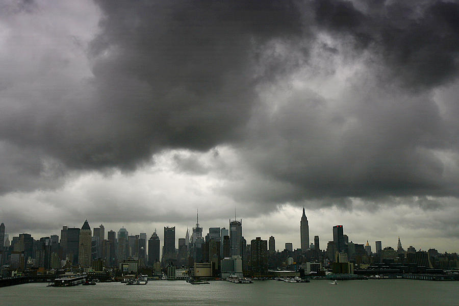 A Low Layer Of Dark Clouds Hangs Over Photograph by New York Daily News Archive