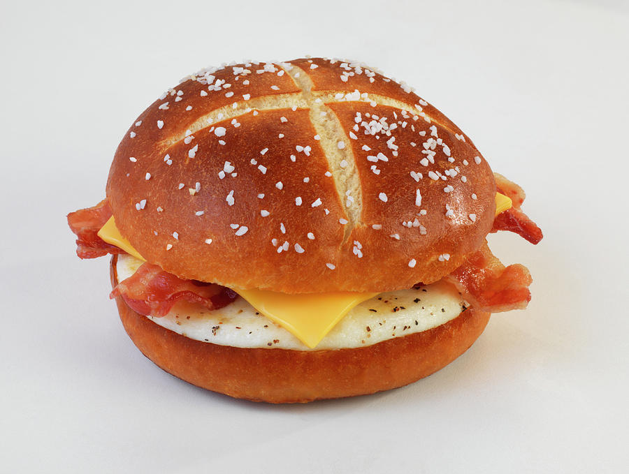 A Lye Bread Roll With Bacon, Cheese And Fried Egg Photograph by Jim Scherer