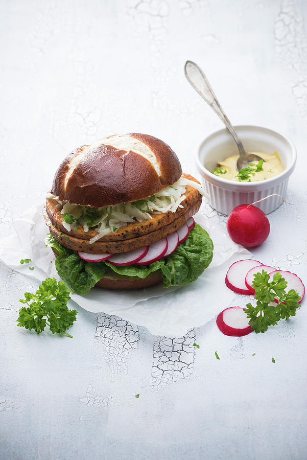 A Lye Bread Roll With Vegan Meatloaf, Coleslaw, Radishes, Lettuce And Mustard Photograph by Kati Neudert