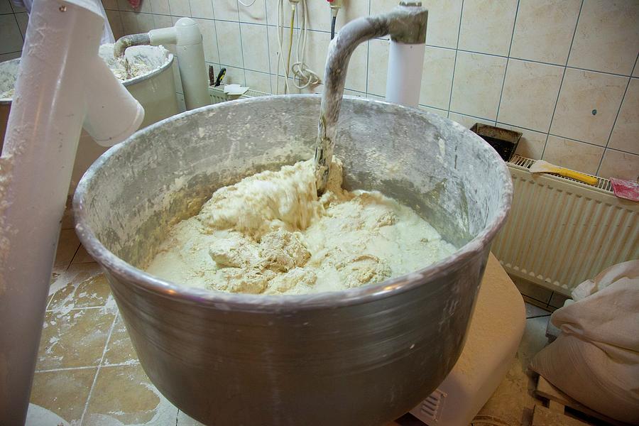 A Machine Kneading Bread Dough At A Bakery Photograph by Studio Lipov