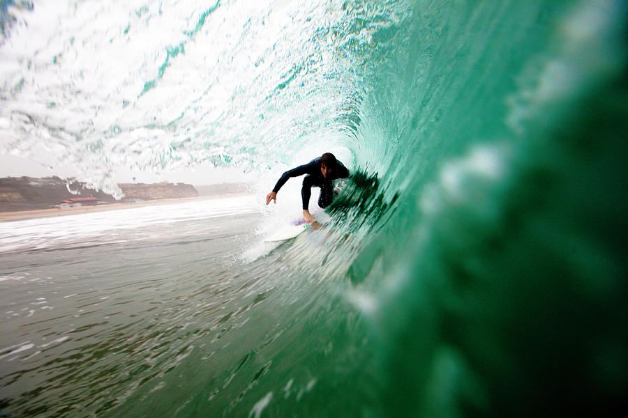A Male Surfer Pulls Into A Barrel While Photograph by Kyle Sparks