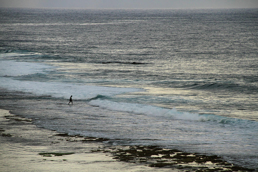 A Man Walking Into Wild Sea Waves Photograph by Danial Shah