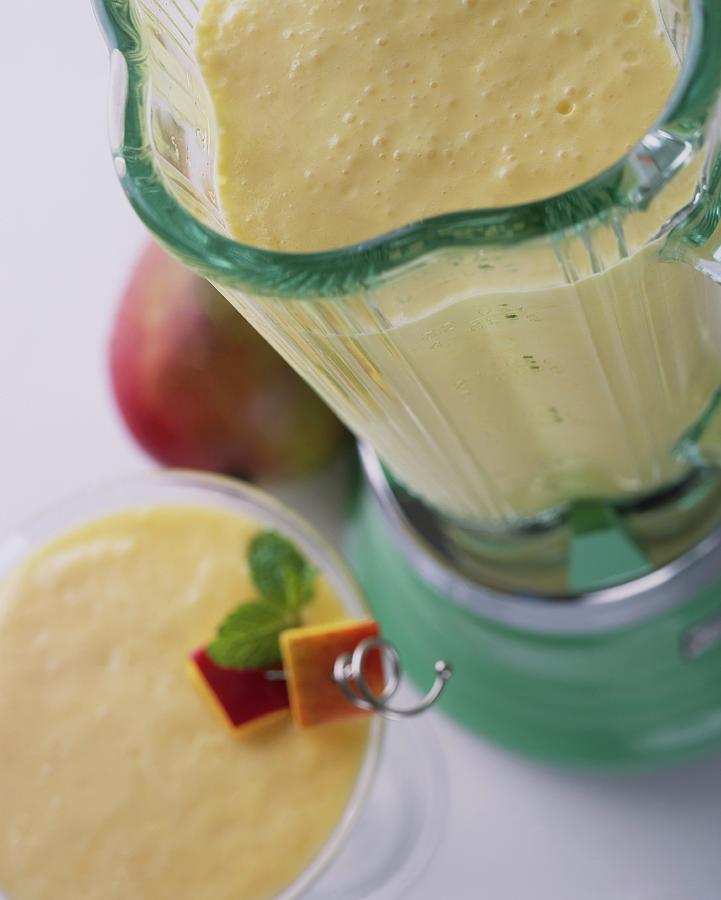 A Mango Smoothie In A Blender Photograph by Kurt Wilson