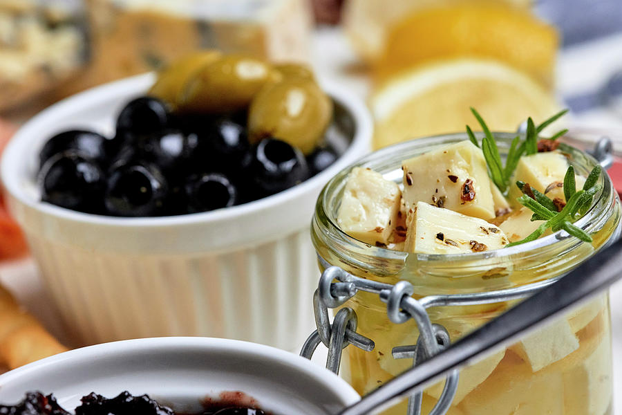 A Mediterranean Appetizer Platter With Olives And Pickled Cheese Photograph by Natasa Dangubic