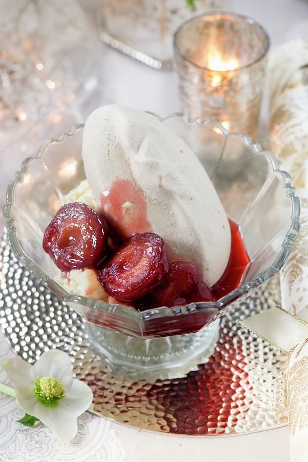 A Meringue With Cream And Balsamic Plums As A Festive Dessert Photograph by Winfried Heinze