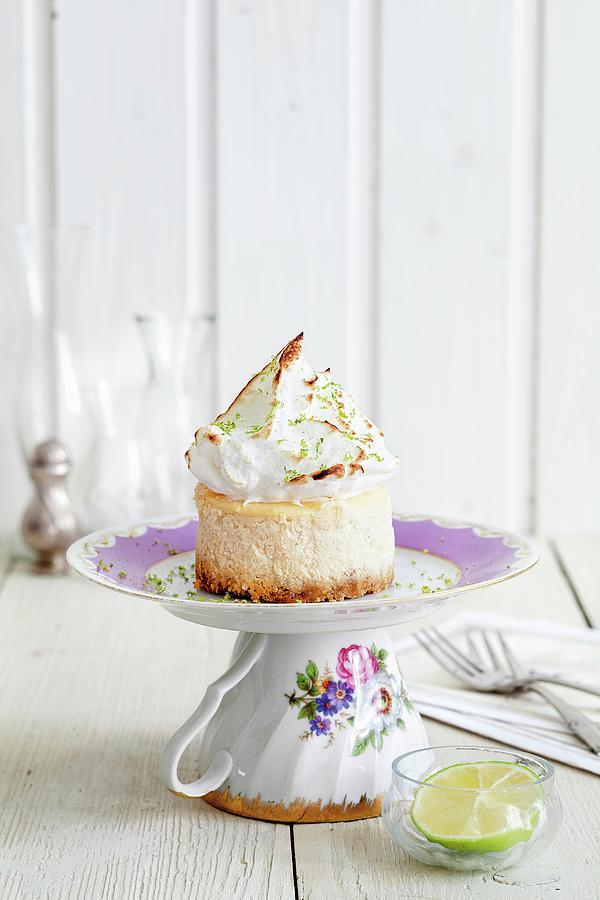 A Mini Cheesecake Topped With Meringue On A Saucer Photograph by Jalag / Jan C. Brettschneider