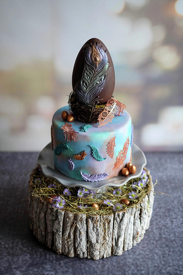A Mini Easter Cake Topped With A Peacock Feather Chocolate Egg Photograph by Marions Kaffeeklatsch