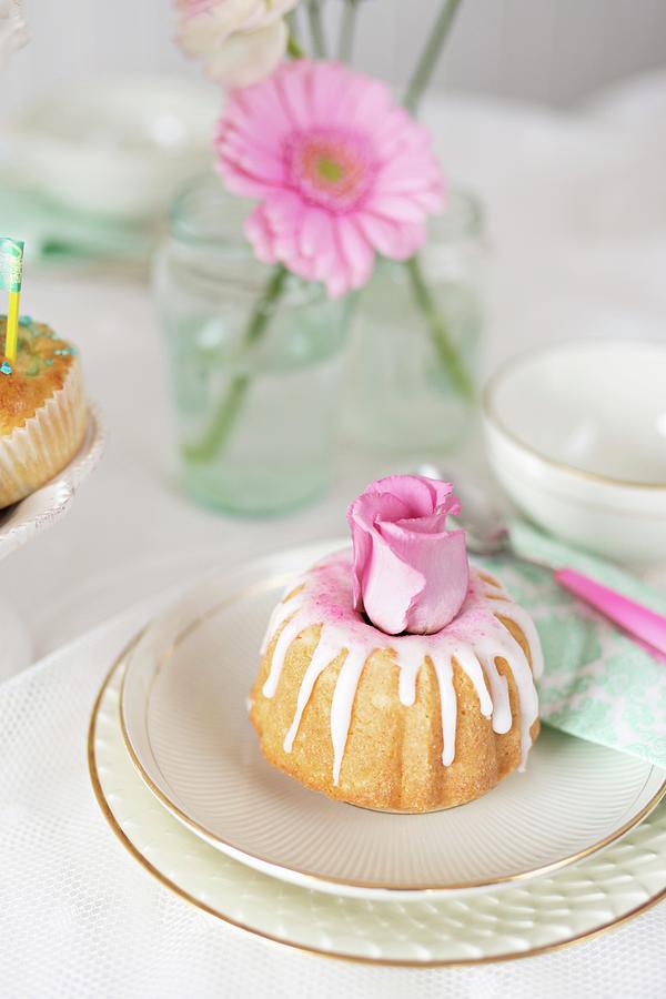 A Mini Iced Bundt Cake Decorated With Roses Photograph by Cecilia Mller
