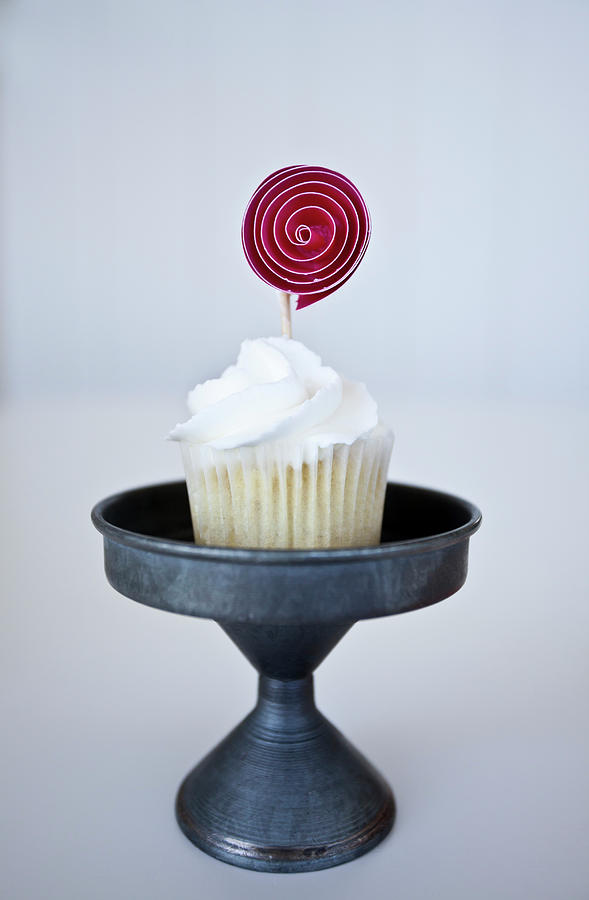 A Mini Vanilla Cupcake With A Pink Cupcake Topper Photograph by Ryla Campbell