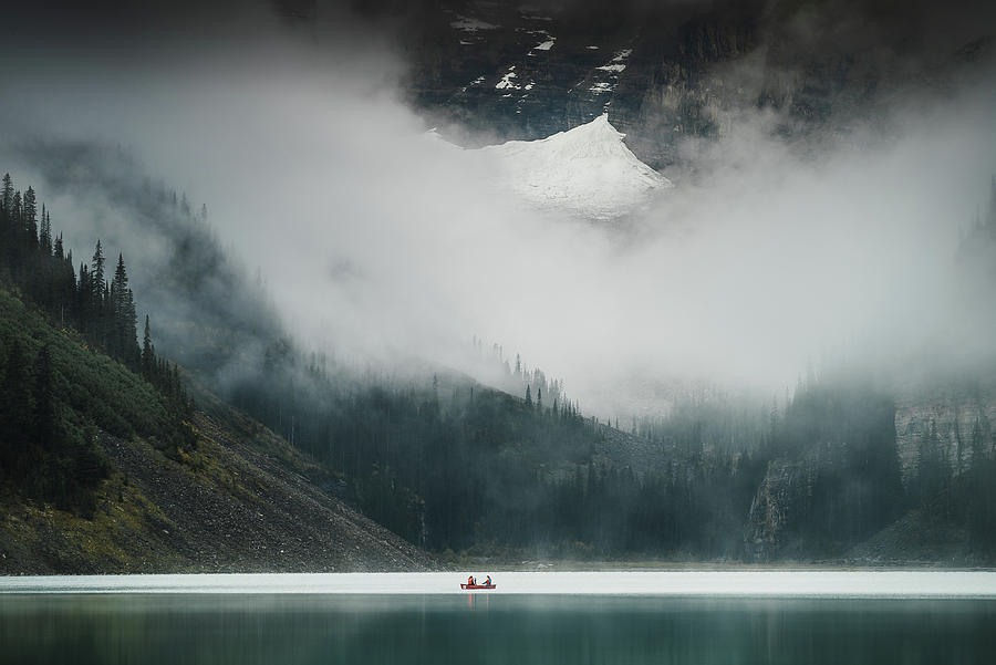 A misty morning at the Lake Louise in Banff National Park in Canada Photograph by Kamran Ali