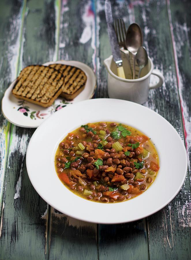 A Mixed Bean Dish With Toasted Bread Photograph by Nick Sida