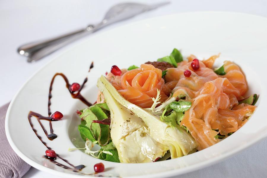 A Mixed Leaf Salad With Artichokes, Smoked Salmon And Pomegranate Seeds Photograph by Lydie Besancon