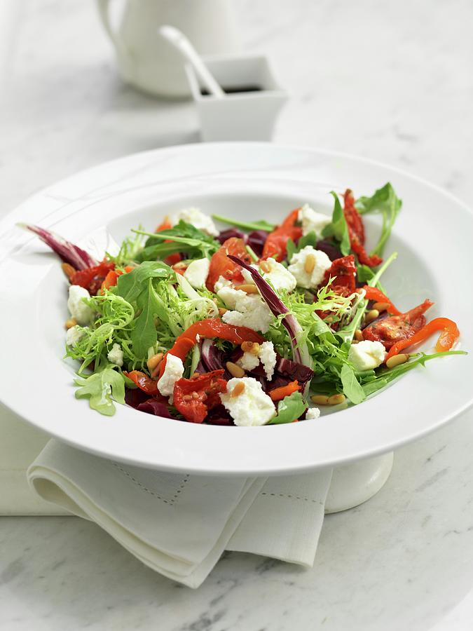 A Mixed Leaf Salad With Goats Cheese, Peppers And Pine Nuts Photograph by Hugh Johnson