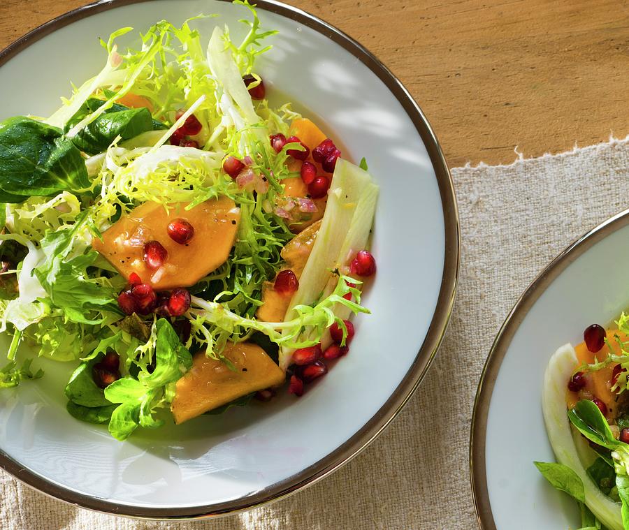 A Mixed Leaf Salad With Mango And Pomegranate Seeds Photograph by Jim Scherer