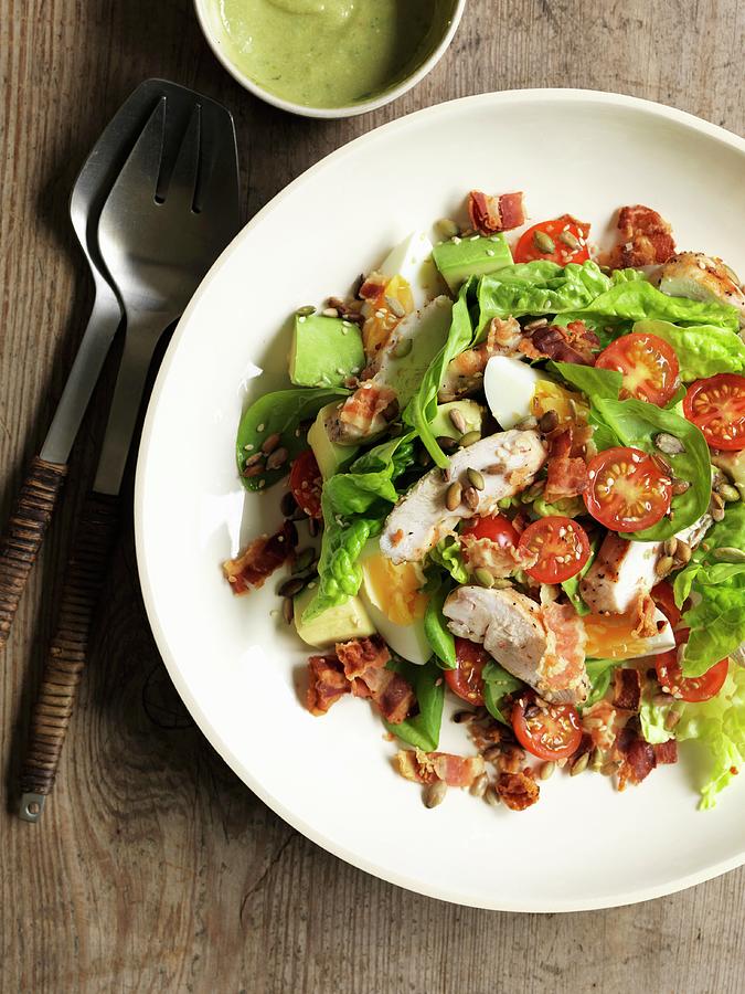 A Mixed Salad With Avocado, Egg, Tomatoes, Bacon And Chicken Breast Photograph by Jonathan Gregson