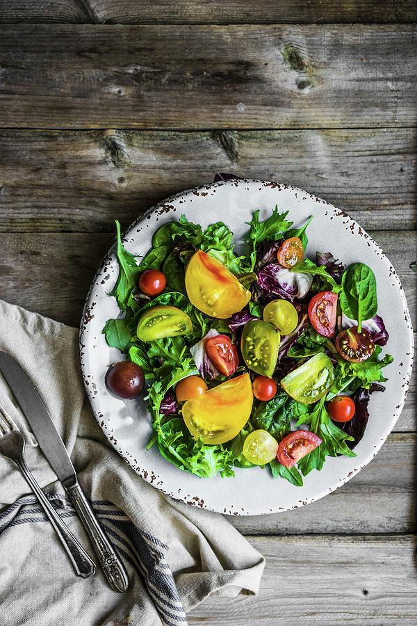 A Mixed Salad With Spinach, Rocket And Heirloom Tomatoes Photograph by Alena Haurylik