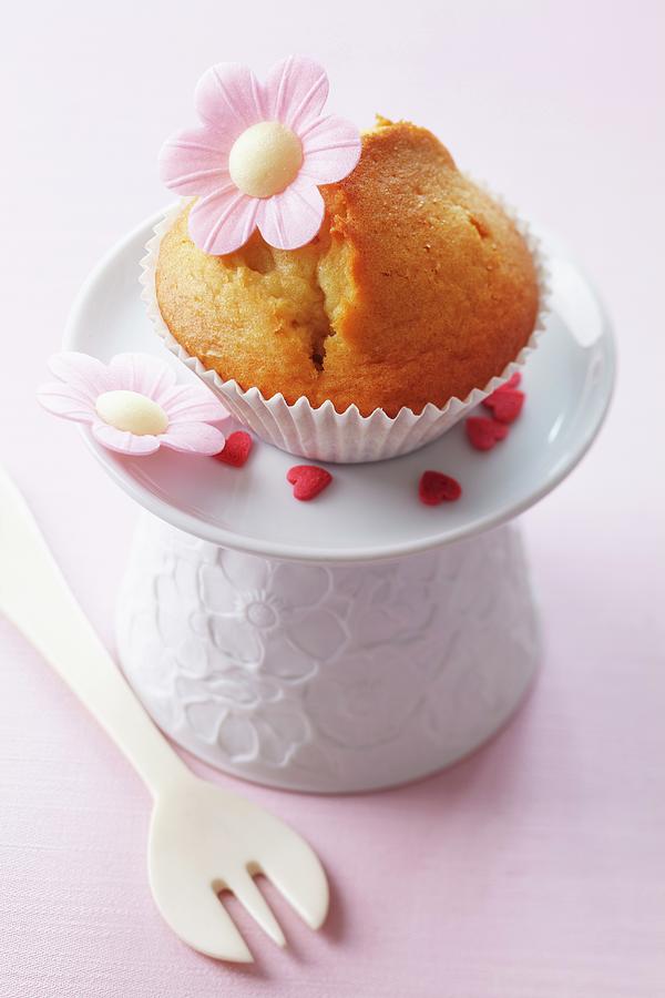 A Muffin Decorated With A Flower Made From Edible Paper Photograph by Taube, Franziska