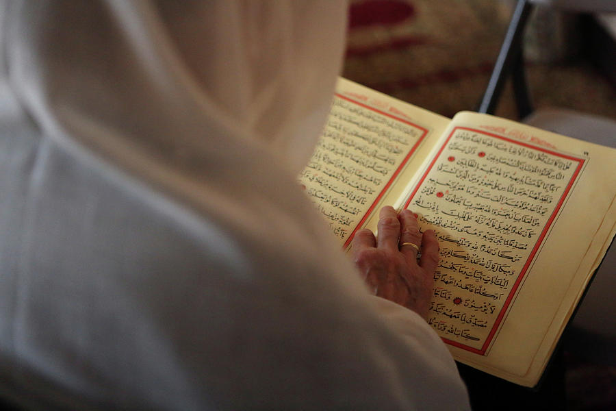 A Muslim Woman Reads the Koran at Eyup Photograph by Gabriela Bhaskar ...