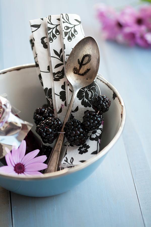 A Napkin With A Blackberry Napkin Ring And A Spoon With Initials In A Blue Enamel Bowl Photograph by Martina Schindler
