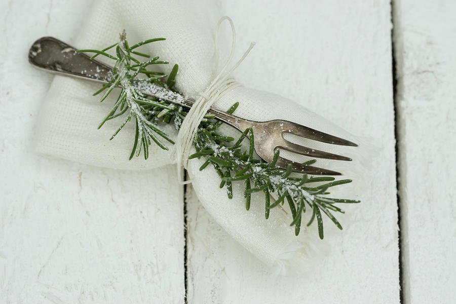A Napkin With A Silver Fork And A Sprig Of Rosemary Photograph by Martina Schindler