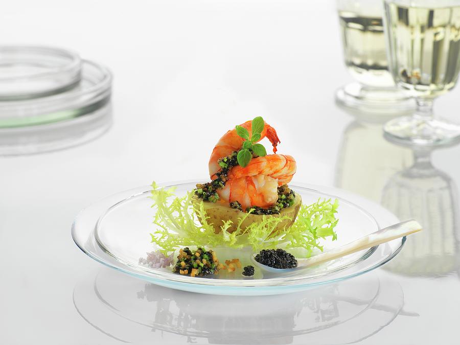 A New Potato With Prawns And Caviar On A Glass Plate Photograph by Wolfgang Pfannenschmidt