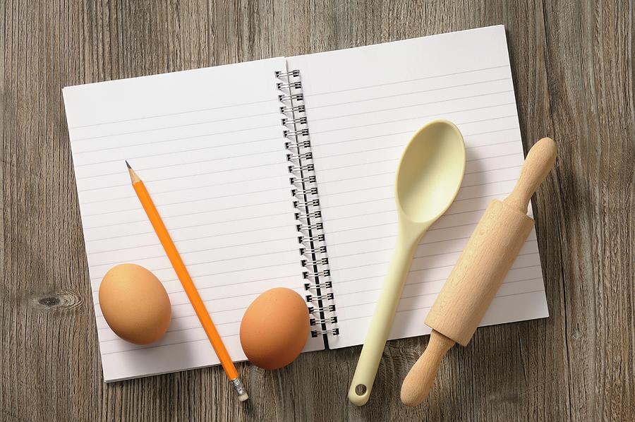 A Notebook, Kitchen Utensils And Eggs Photograph by Jean-christophe Riou
