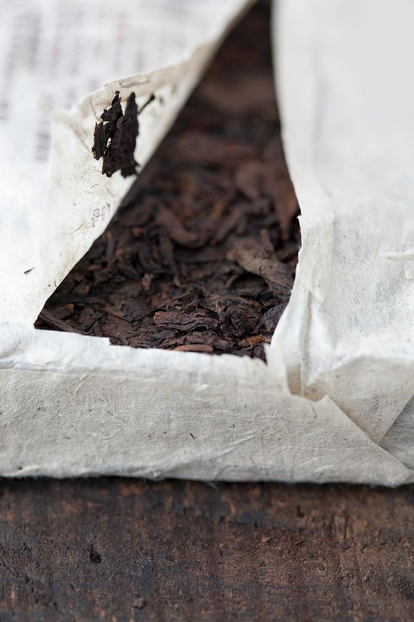 A Packaged Pu-ehr Tea Brick close-up Photograph by Martina Schindler
