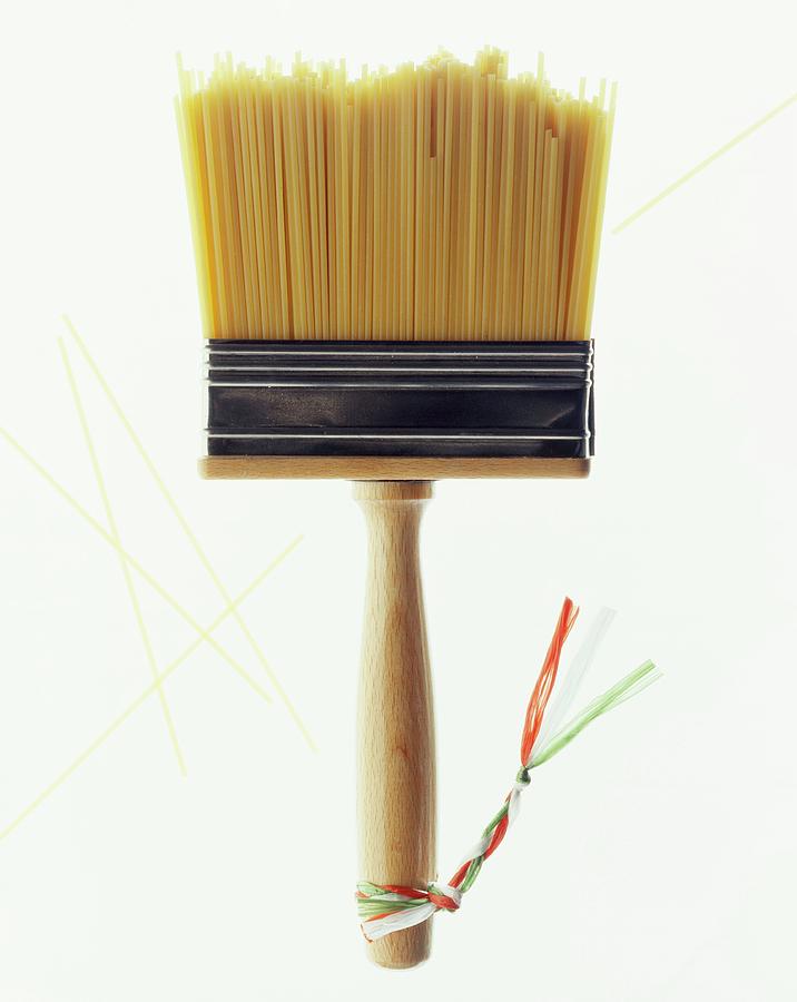 Holiday Photograph - A Paintbrush With Bristles Made Of Spaghetti And Little Ribbons In The Italian Colours by Michael Wissing