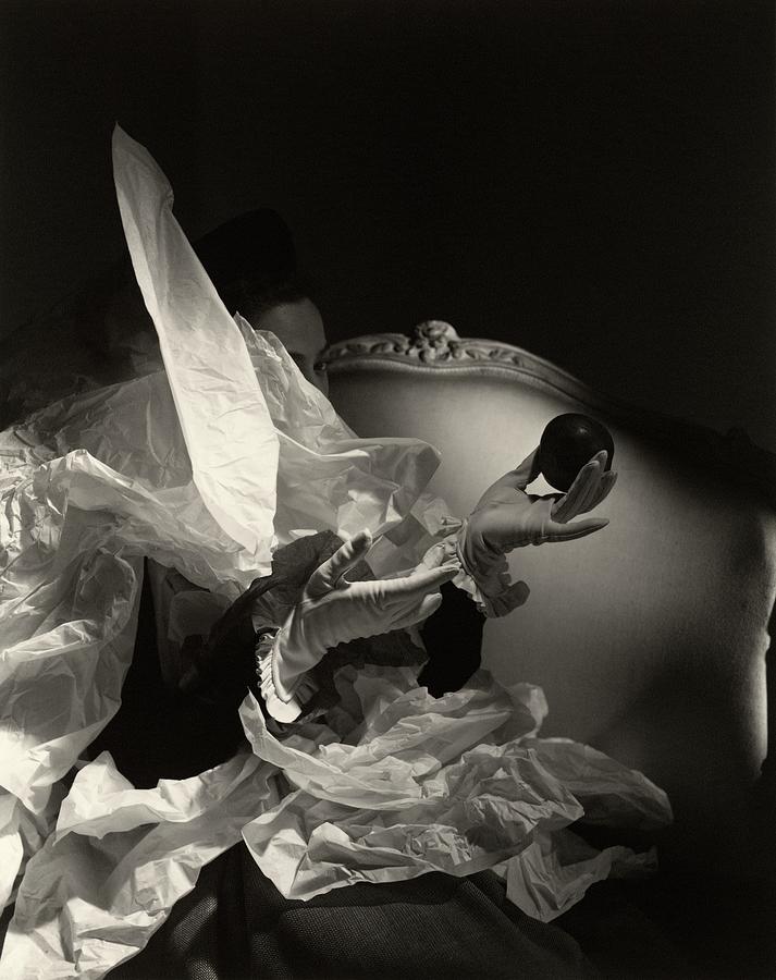 A Pair Of Hands In Gloves Holding An Apple Photograph by Horst P Horst