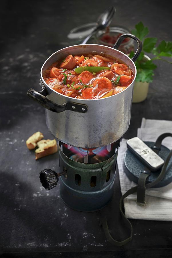 A Pan Of Sausage Goulash On A Gas Stove Photograph by Thorsten Strmer