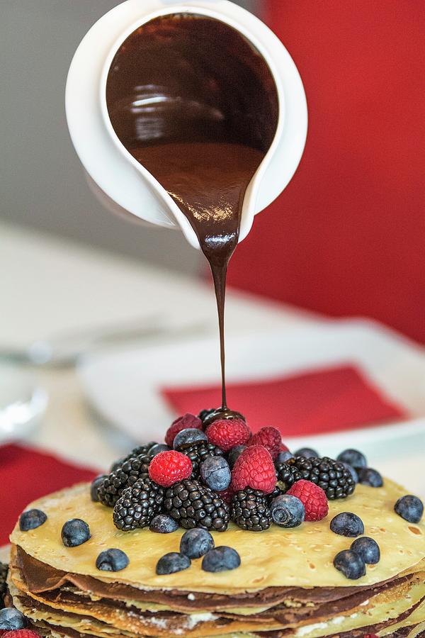 A Pancake Cake With Berries And Chocolate Sauce Photograph by Chris Schfer