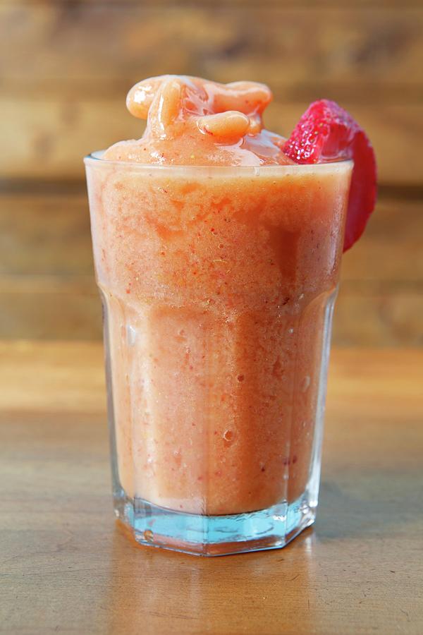 A Peach Smoothie Made With Apple Juice, Oranges And Strawberries Photograph by Amy Kalyn Sims