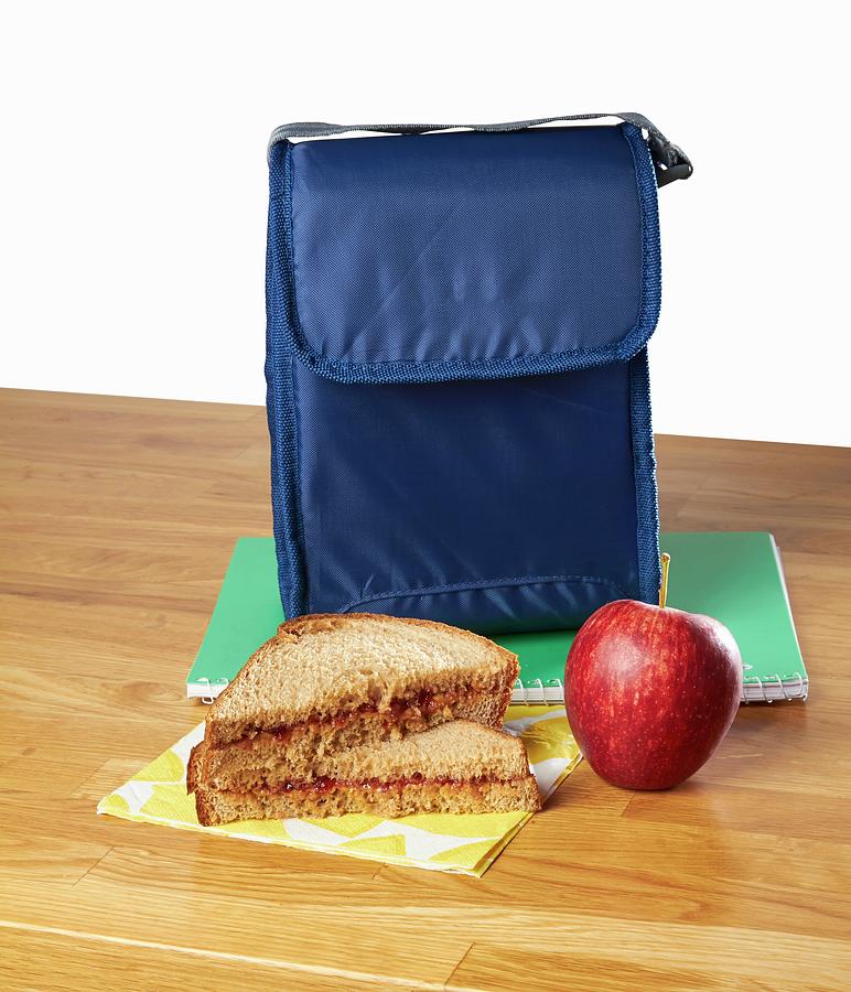 A Peanut Butter Sandwich And An Apple As A Snack With A Lunch Bag Photograph by Allison Dinner