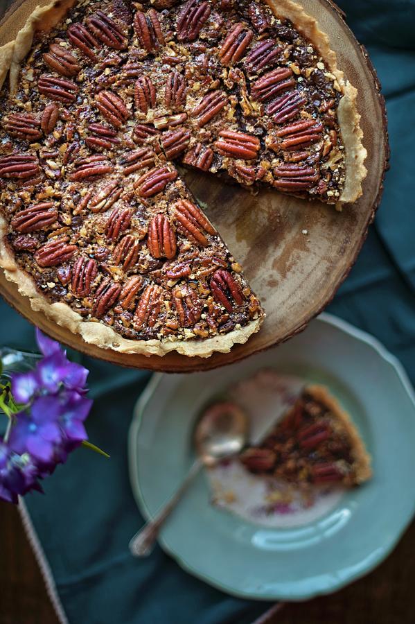 A Pecan Nut Tart, Sliced, On A Cake Stand Photograph by Magdalena Hendey