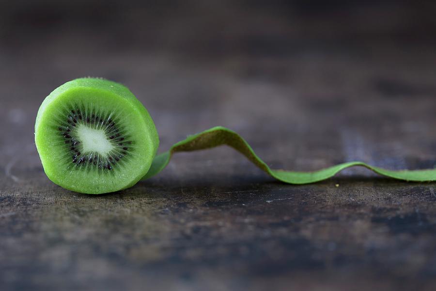 A Peeled Kiwi Photograph by Malgorzata Laniak
