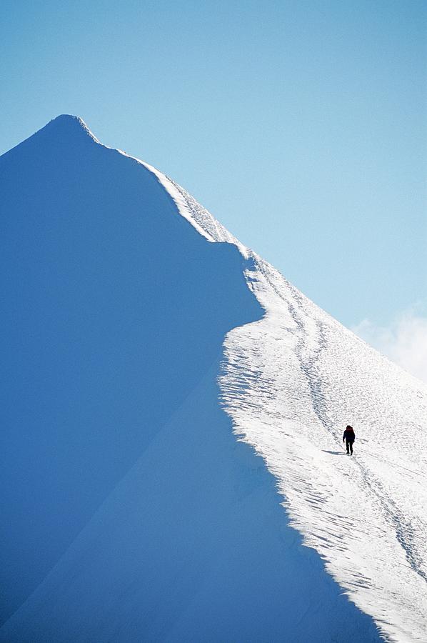 A Person Hiking On A Mountain Peak Photograph by Hakan Hjort
