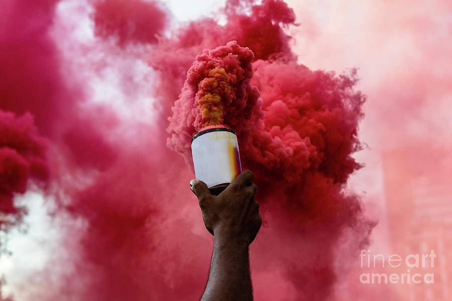 A Person Holding A Can With Red Smoke Photograph by I Am Bad Photographer