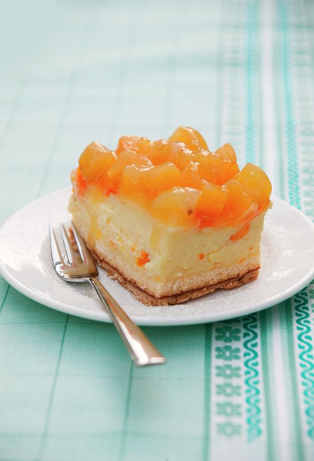 A Piece Of Apricot Cheesecake Photograph by Food Experts Group